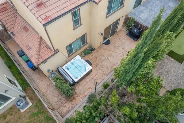 an aerial view of a houses with a yard