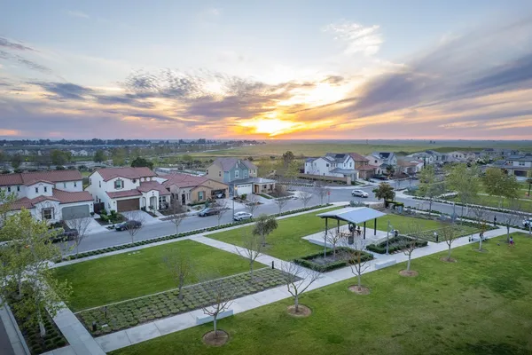 an aerial view of residential houses with outdoor space