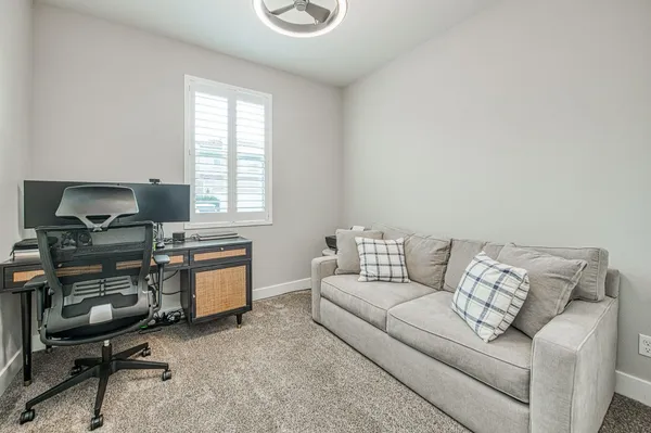 a kitchen with kitchen island a stove a sink a center island and a refrigerator