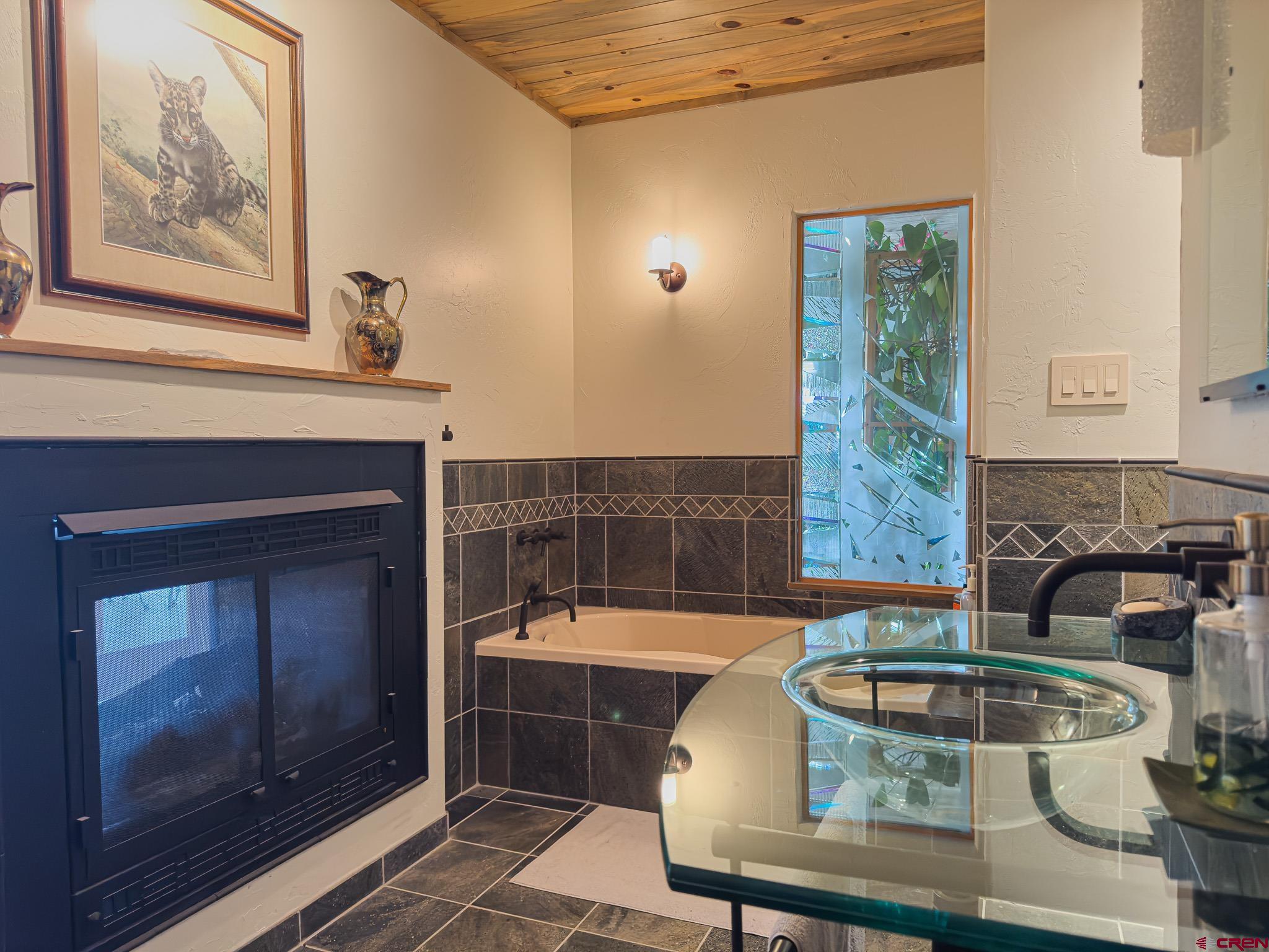 1071 Black Canyon Road Crawford, CO 81415 - Photo 17 of 36 a living room with furniture and a fireplace