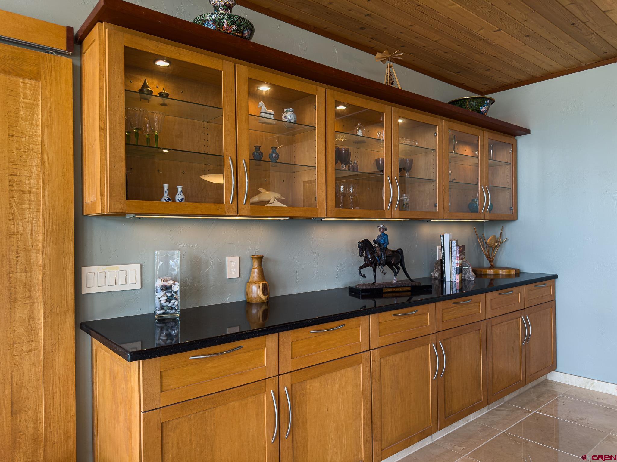 1071 Black Canyon Road Crawford, CO 81415 - Photo 23 of 36 a kitchen with stainless steel appliances granite countertop a sink a stove and cabinets