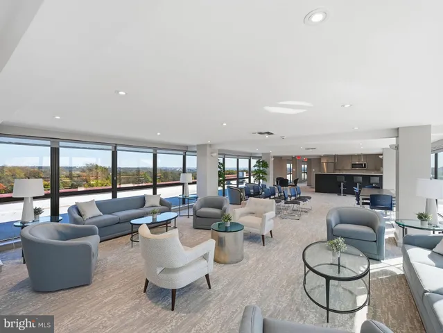 a kitchen with kitchen island a sink stove and refrigerator