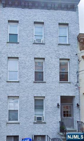 829 Willow Avenue, Unit 3 Hoboken, NJ 07030 - Photo 1 of 16 a bricked building with four windows