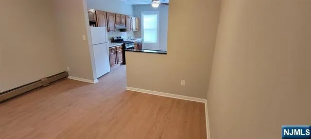 a view of a kitchen from the hallway