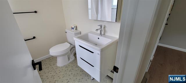 829 Willow Avenue, Unit 3 Hoboken, NJ 07030 - Photo 13 of 16 a bathroom with a sink toilet and mirror