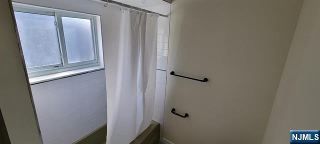 829 Willow Avenue, Unit 3 Hoboken, NJ 07030 - Photo 14 of 16 a bathroom with a shower