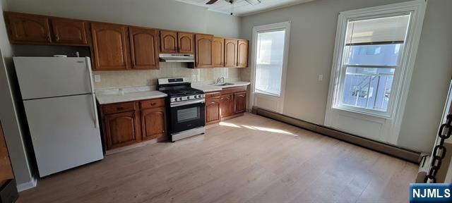 829 Willow Avenue, Unit 3 Hoboken, NJ 07030 - Photo 2 of 16 a kitchen with stainless steel appliances granite countertop a refrigerator sink and stove
