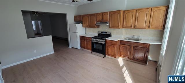 829 Willow Avenue, Unit 3 Hoboken, NJ 07030 - Photo 3 of 16 a kitchen with a sink cabinets and stainless steel appliances