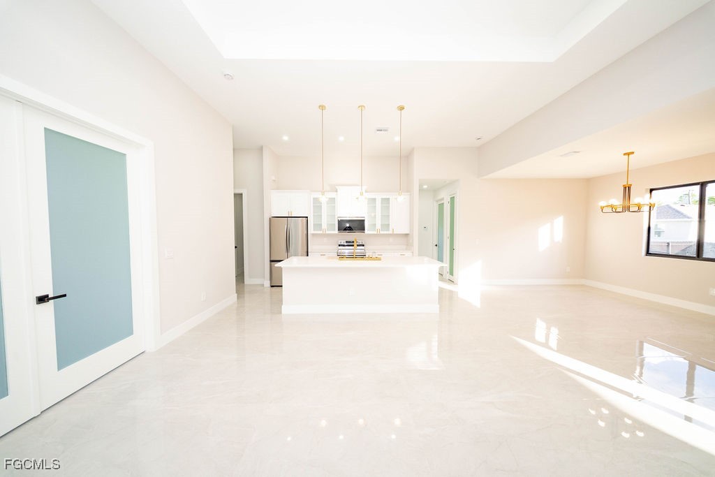 2819 34th Street West Lehigh Acres, FL 33971 - Photo 13 of 41 a view of a big room with wooden floor and windows