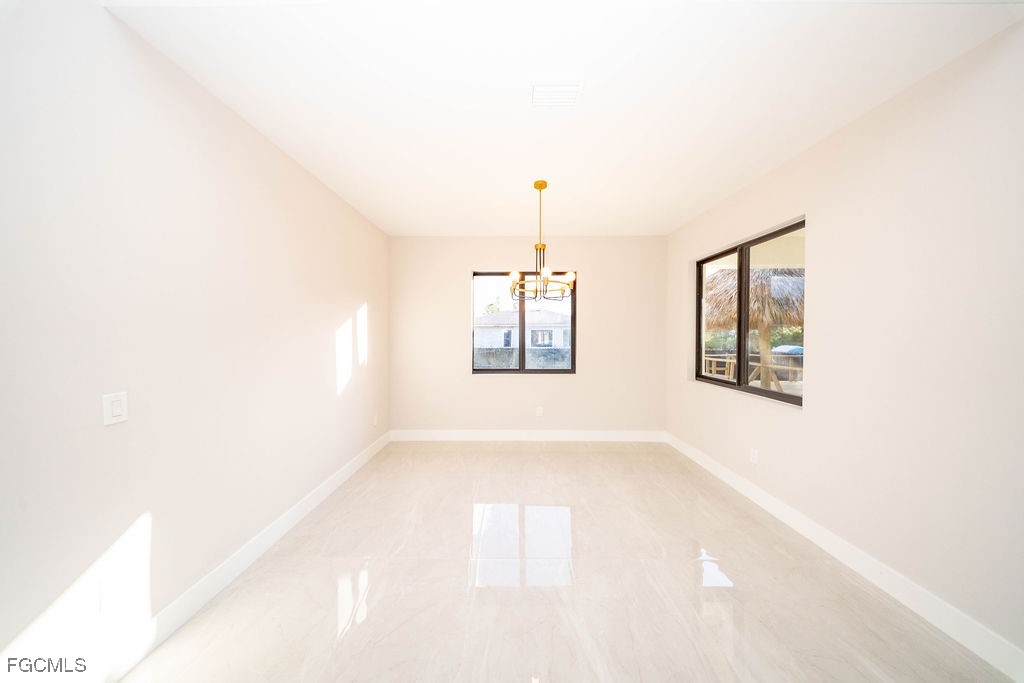 2819 34th Street West Lehigh Acres, FL 33971 - Photo 21 of 41 a view of an empty room with windows