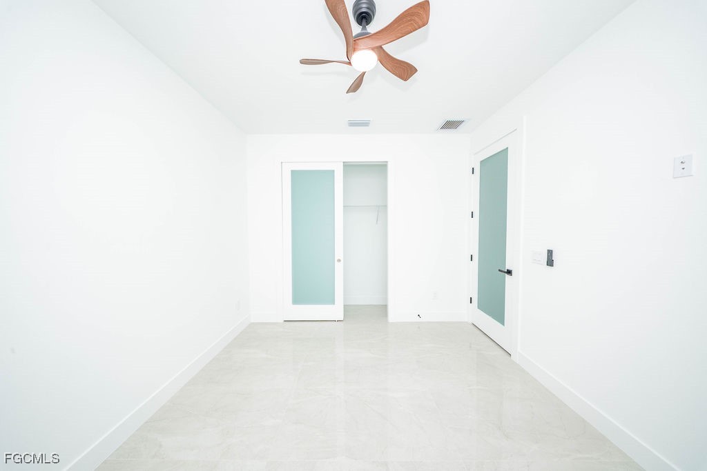 2819 34th Street West Lehigh Acres, FL 33971 - Photo 23 of 41 a view of an empty room