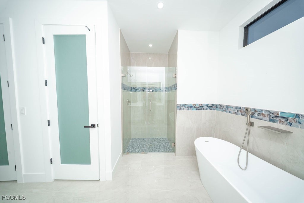 2819 34th Street West Lehigh Acres, FL 33971 - Photo 26 of 41 a bathroom with a shower