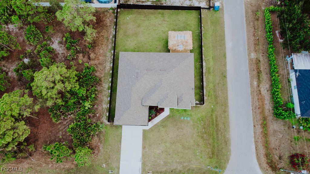 2819 34th Street West Lehigh Acres, FL 33971 - Photo 36 of 41 an aerial view of a house with a yard