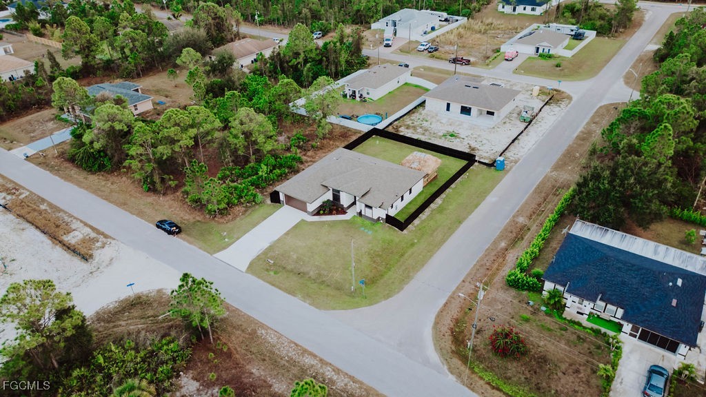 2819 34th Street West Lehigh Acres, FL 33971 - Photo 39 of 41 an aerial view of a house with a swimming pool