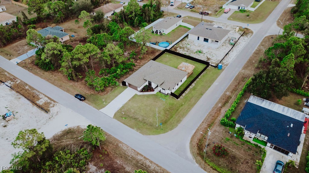 2819 34th Street West Lehigh Acres, FL 33971 - Photo 41 of 41 an aerial view of a house with a swimming pool