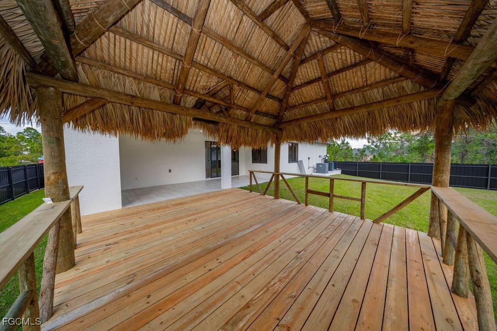 2819 34th Street West Lehigh Acres, FL 33971 - Photo 9 of 41 a view of a wooden deck with a yard
