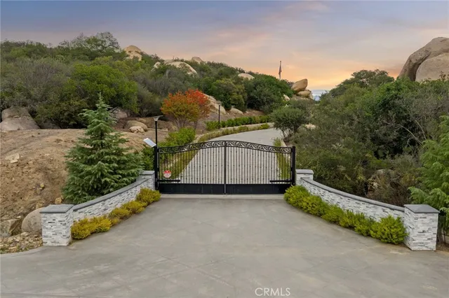 a view of a back yard with a wooden fence