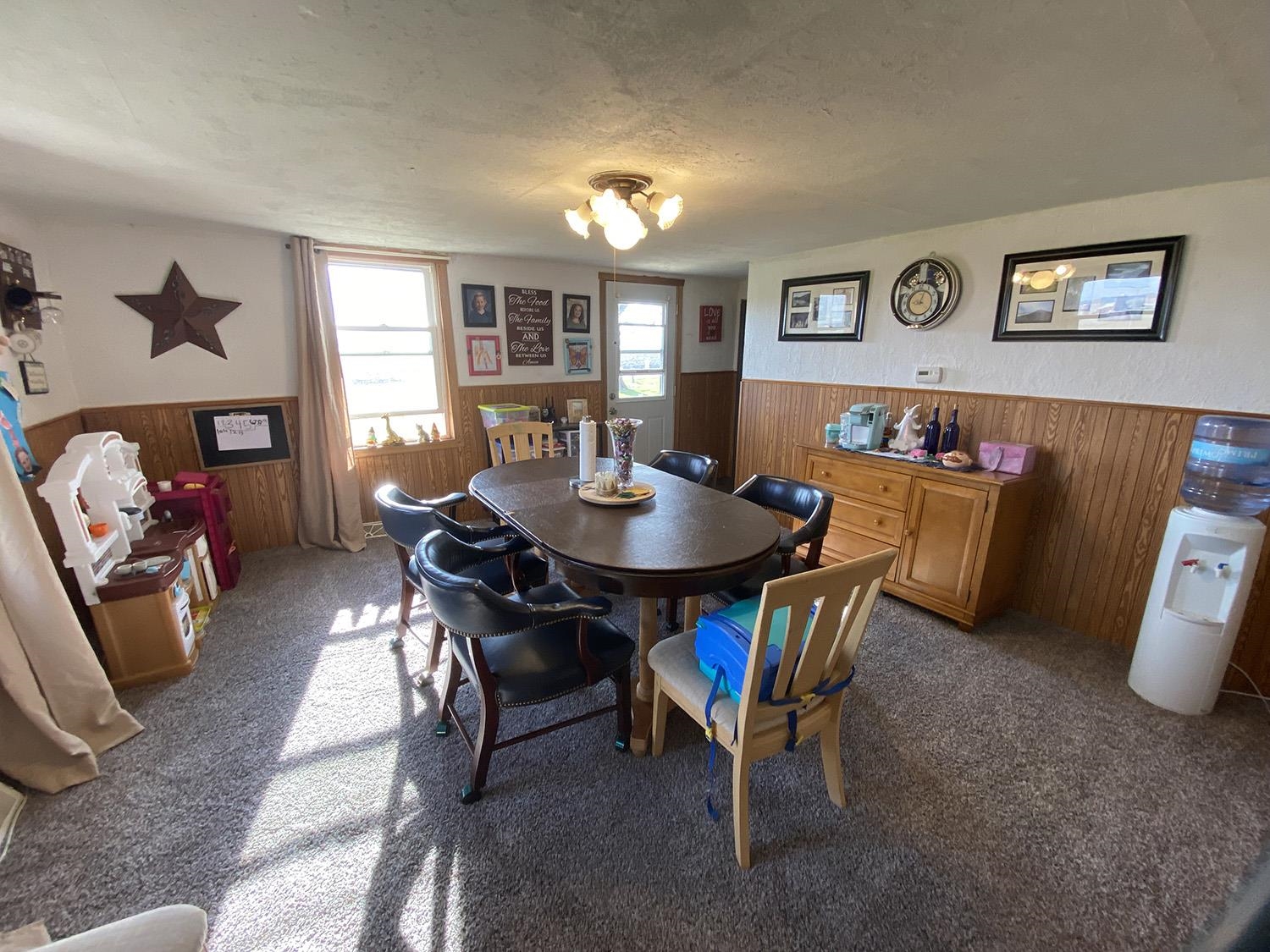 6510 Water Road Lanark, IL 61046 - Photo 20 of 38 a view of a dining room with furniture and a window