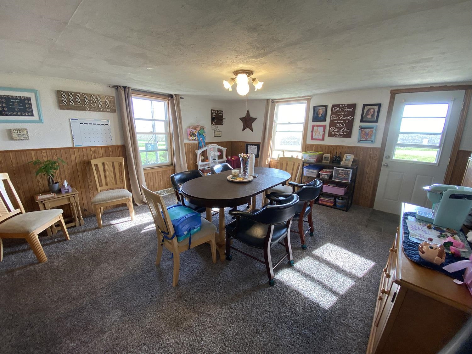 6510 Water Road Lanark, IL 61046 - Photo 21 of 38 a view of a dining room with furniture and window