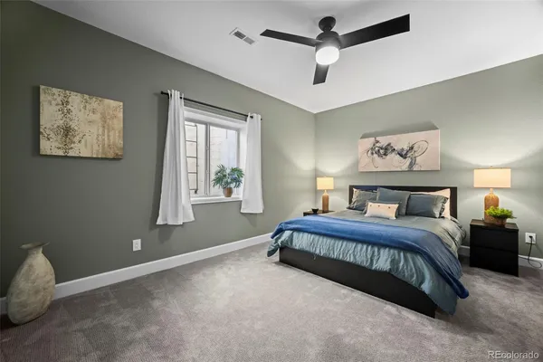 a spacious bedroom with a bed and a window