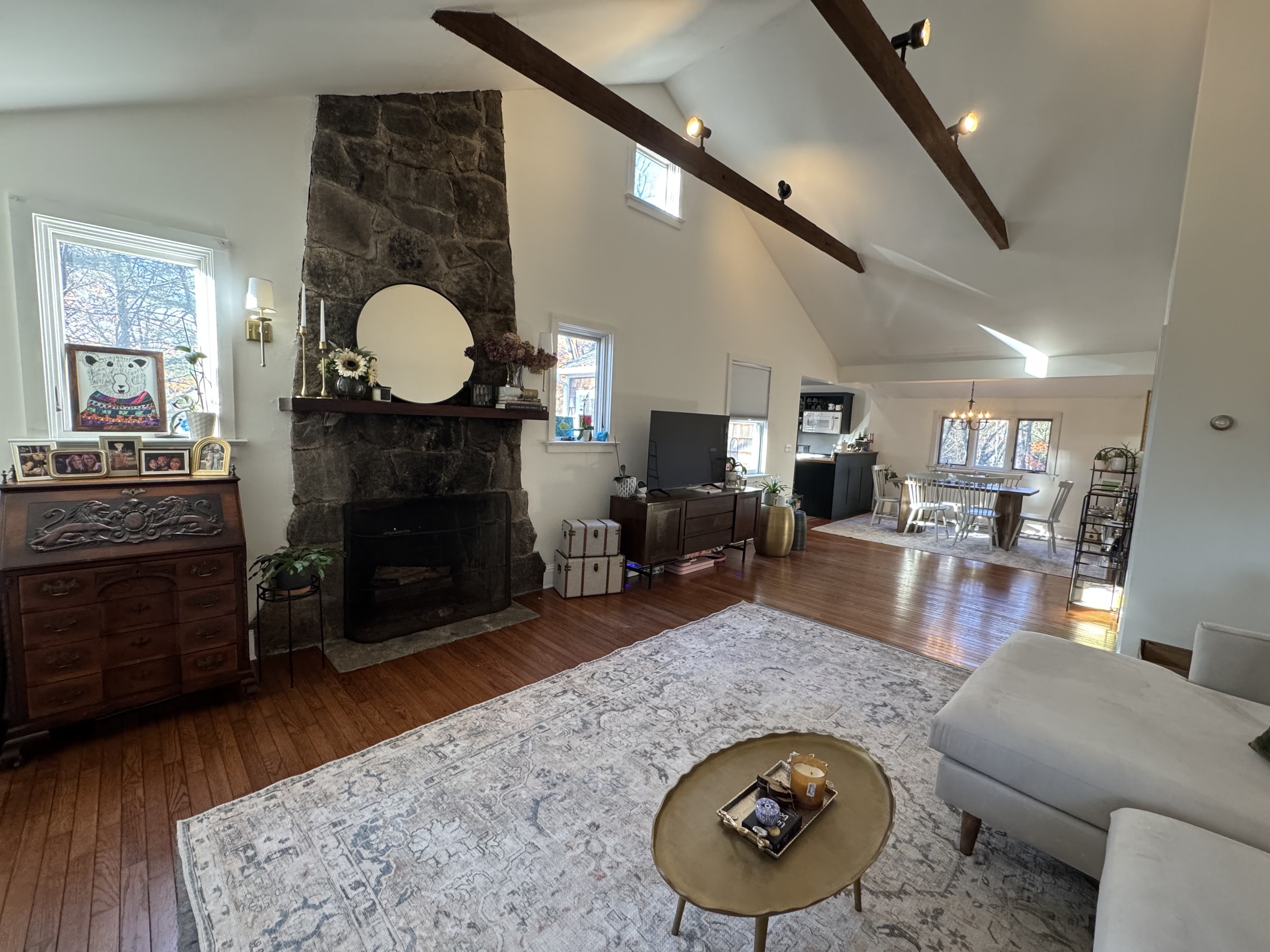 a living room with furniture and a fireplace