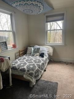 22 Horseshoe Road Wilton, CT 06897 - Photo 12 of 24 a bedroom with a bed and window