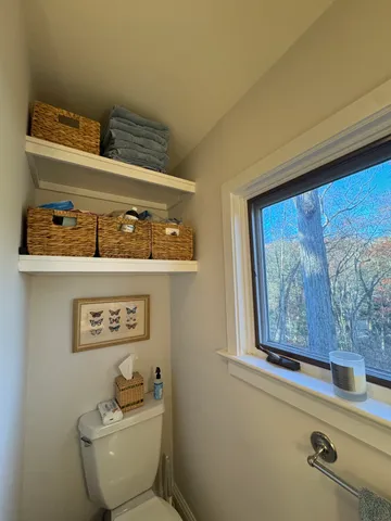 a bathroom with a toilet and a sink