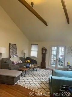 a living room with furniture window and a table