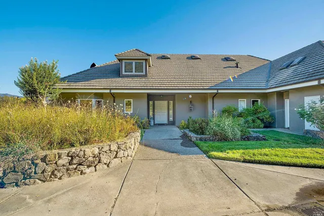 front view of a house with a garden