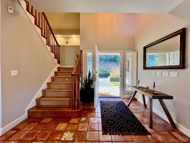 a view of a hallway with seating area