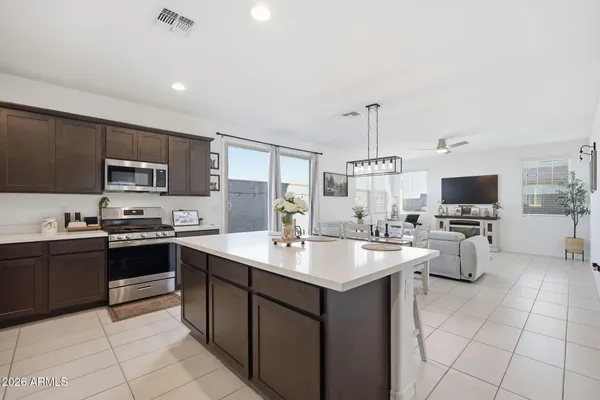 a kitchen with cabinets a sink and appliances