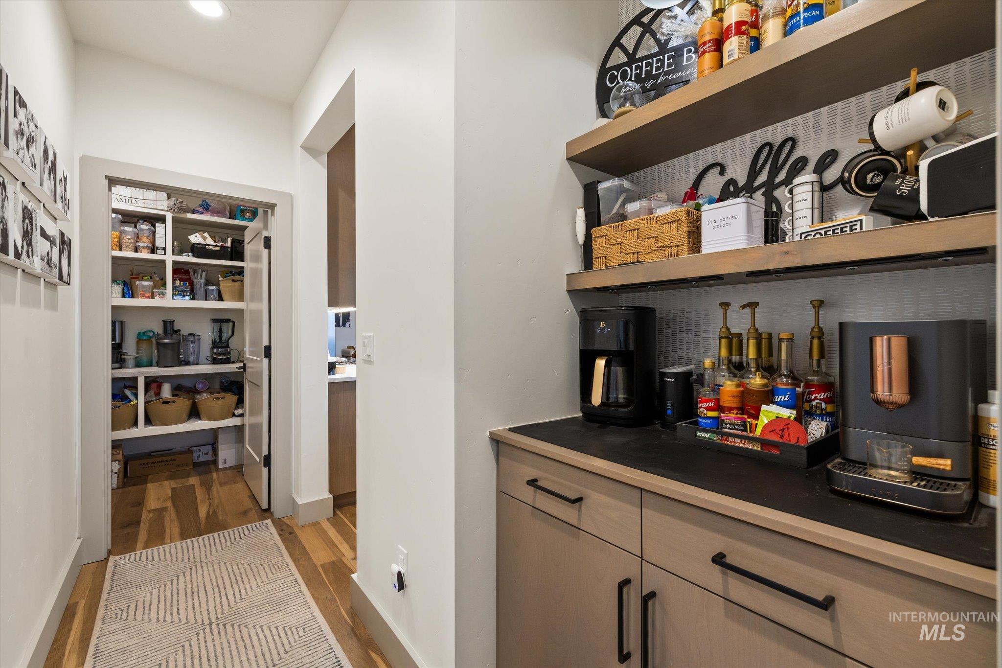 2250 South Steichen Way Meridian, ID 83642 - Photo 17 of 40 Bar area featuring dark wood finished floors and recessed lighting