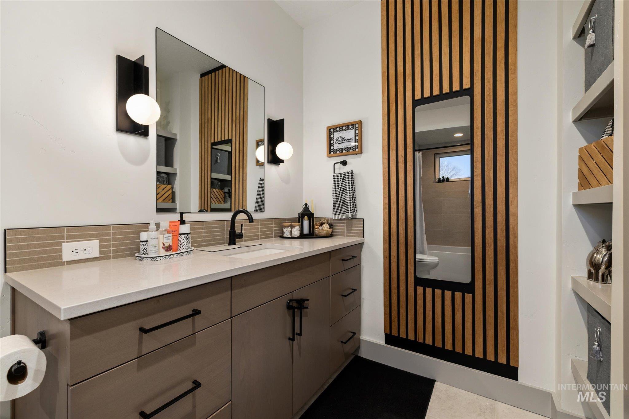 2250 South Steichen Way Meridian, ID 83642 - Photo 24 of 40 Full bath with vanity, backsplash, and shower / bathtub combination with curtain