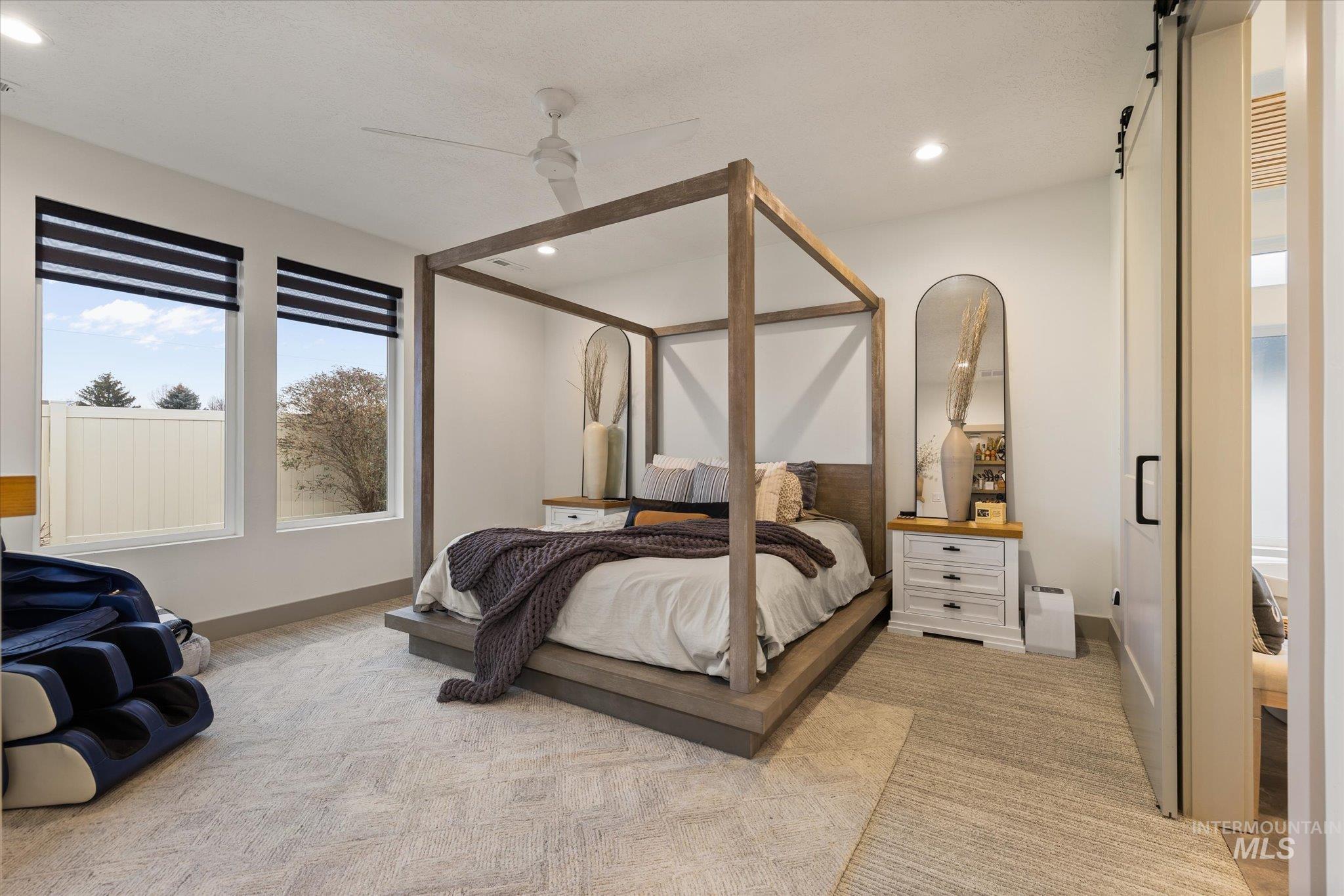 2250 South Steichen Way Meridian, ID 83642 - Photo 27 of 40 Bedroom with a barn door, a ceiling fan, and recessed lighting