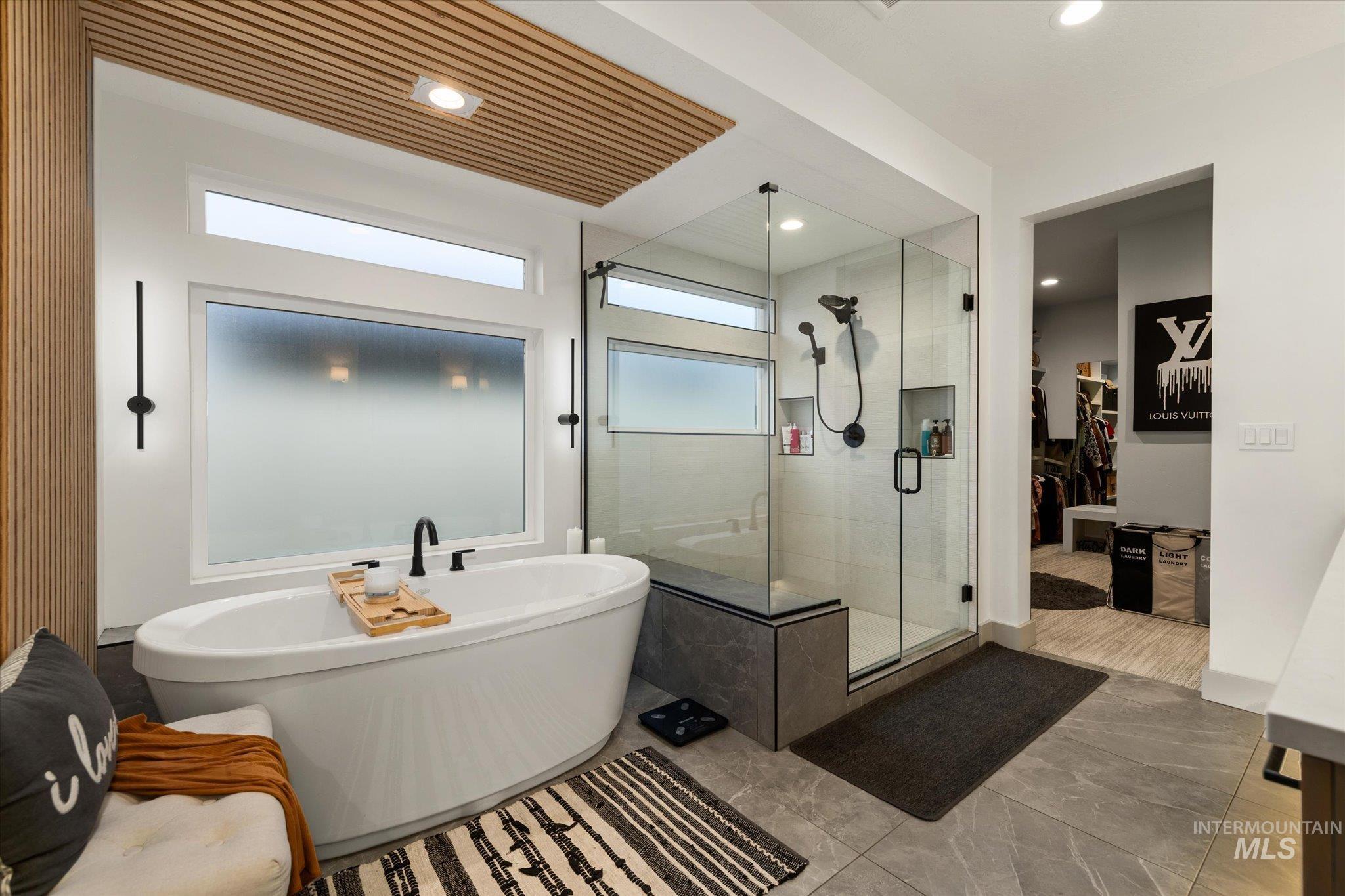 2250 South Steichen Way Meridian, ID 83642 - Photo 31 of 40 Full bath featuring a walk in closet, a freestanding tub, a shower stall, and recessed lighting