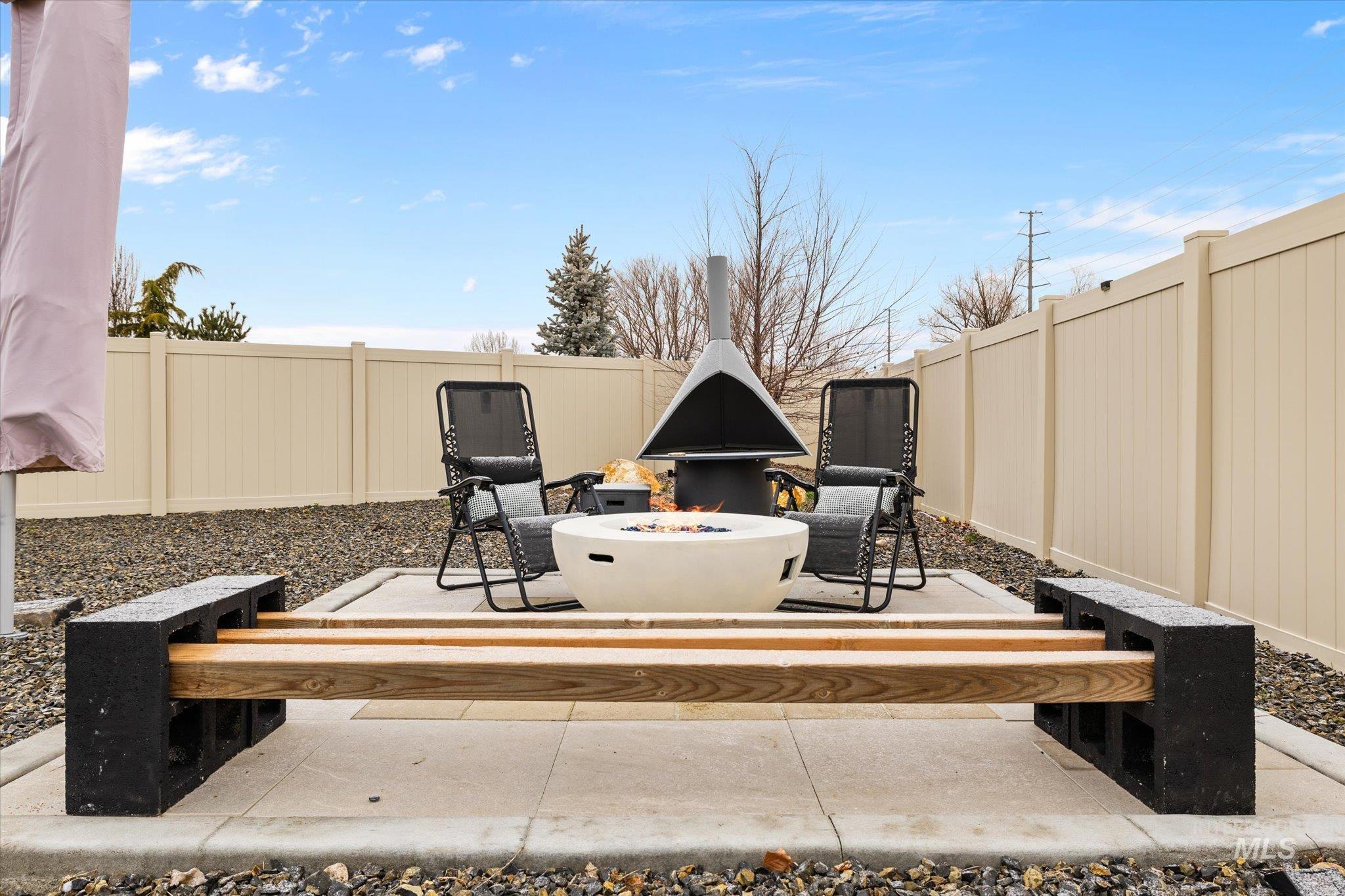 2250 South Steichen Way Meridian, ID 83642 - Photo 36 of 40 Fenced backyard featuring a patio area and an outdoor fire pit
