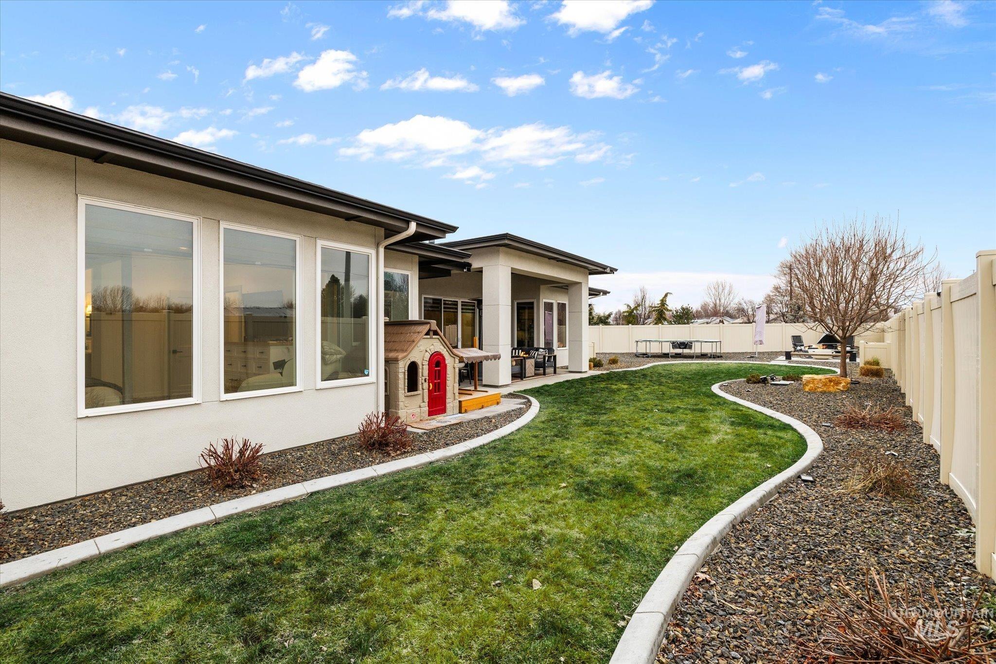 2250 South Steichen Way Meridian, ID 83642 - Photo 38 of 40 Fenced backyard featuring a sunroom and a patio