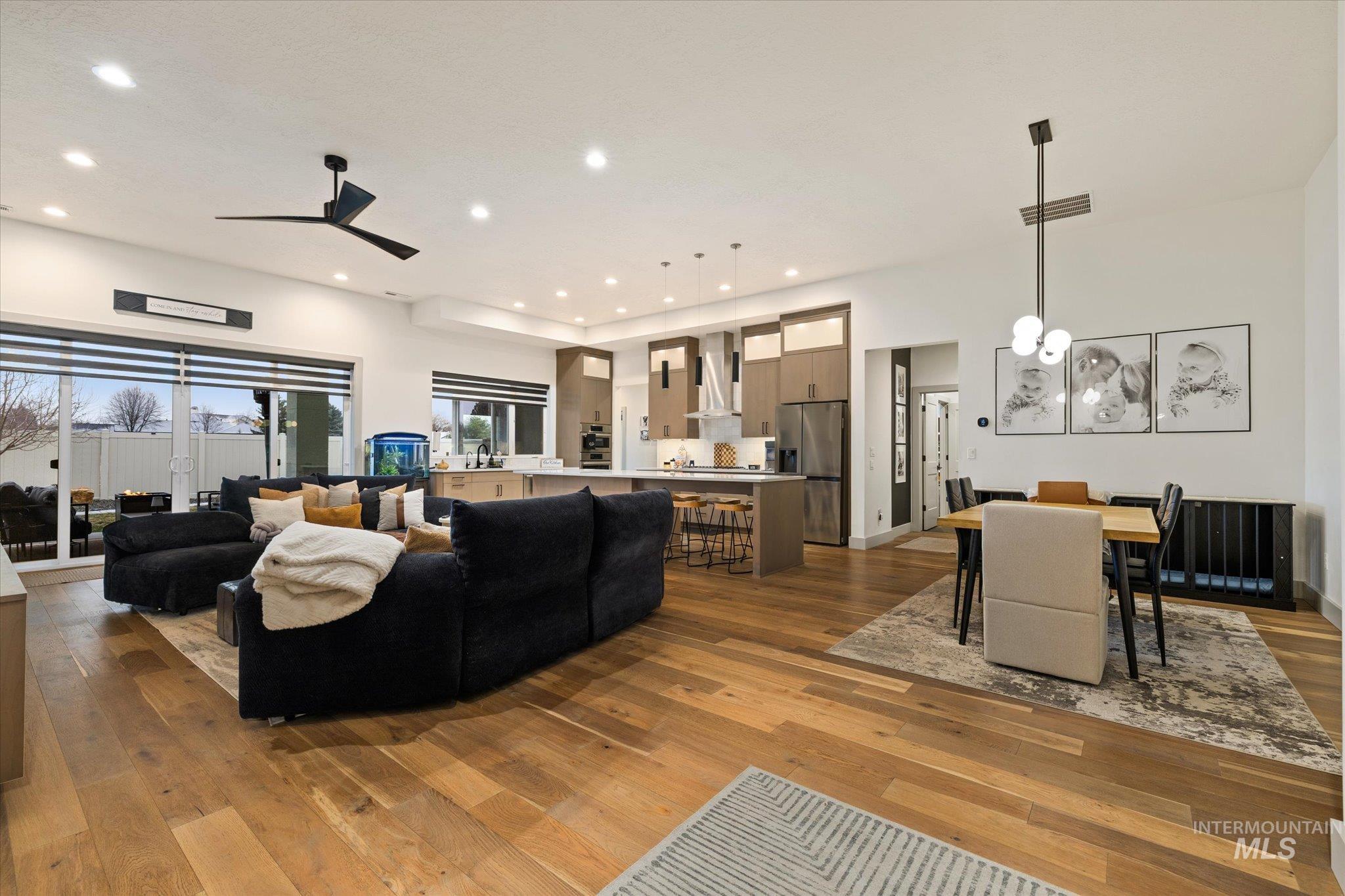 2250 South Steichen Way Meridian, ID 83642 - Photo 6 of 40 Living room featuring dark wood-type flooring, recessed lighting, and a ceiling fan