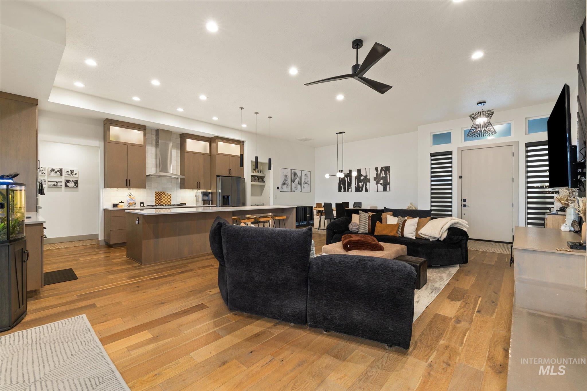 2250 South Steichen Way Meridian, ID 83642 - Photo 8 of 40 Living room with light wood-type flooring, ceiling fan, and recessed lighting