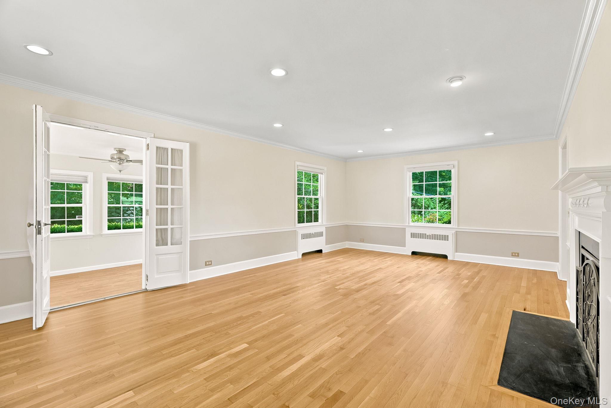 1 Sheridan Road Scarsdale, NY 10583 - Photo 6 of 40 Additional view of living room showing entrance to sunroom