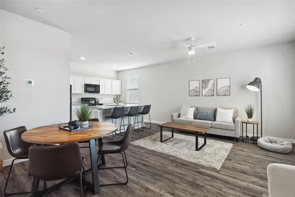 a living room with furniture and a table
