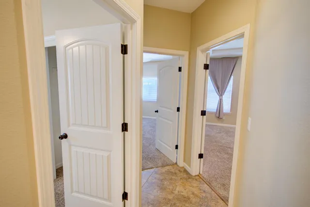 a view of a bathroom from a hallway
