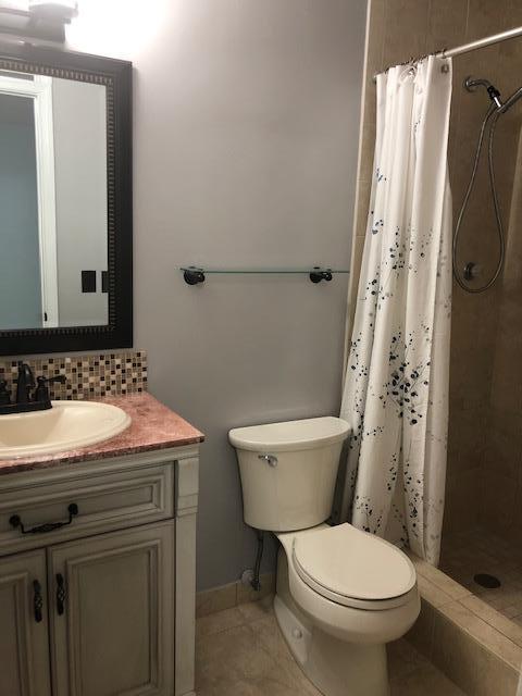 8978 West Sample Road, Unit 203 Coral Springs, FL 33065 - Photo 11 of 13 a bathroom with a sink and a toilet