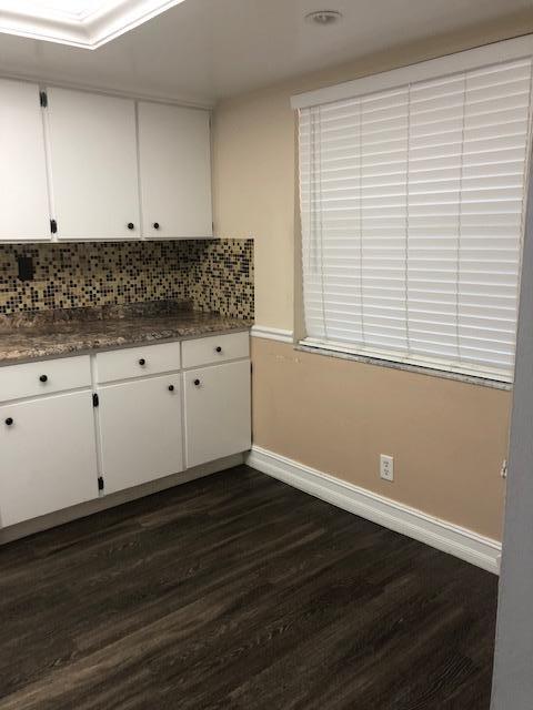 8978 West Sample Road, Unit 203 Coral Springs, FL 33065 - Photo 3 of 13 a view of a kitchen with wooden cabinets