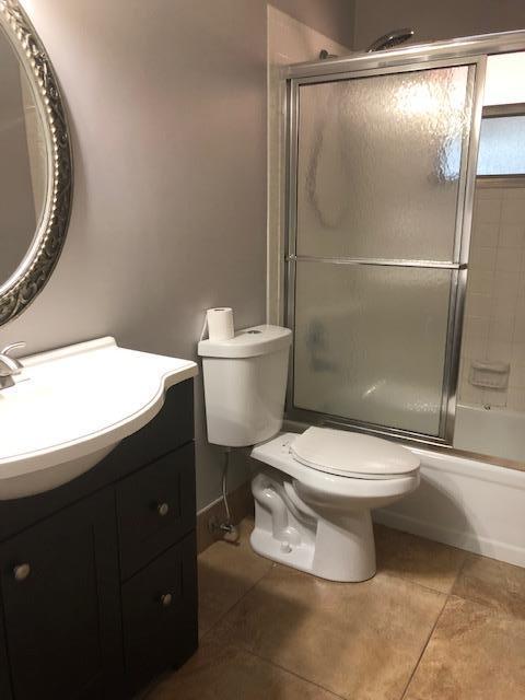 8978 West Sample Road, Unit 203 Coral Springs, FL 33065 - Photo 9 of 13 a bathroom with a toilet and a shower