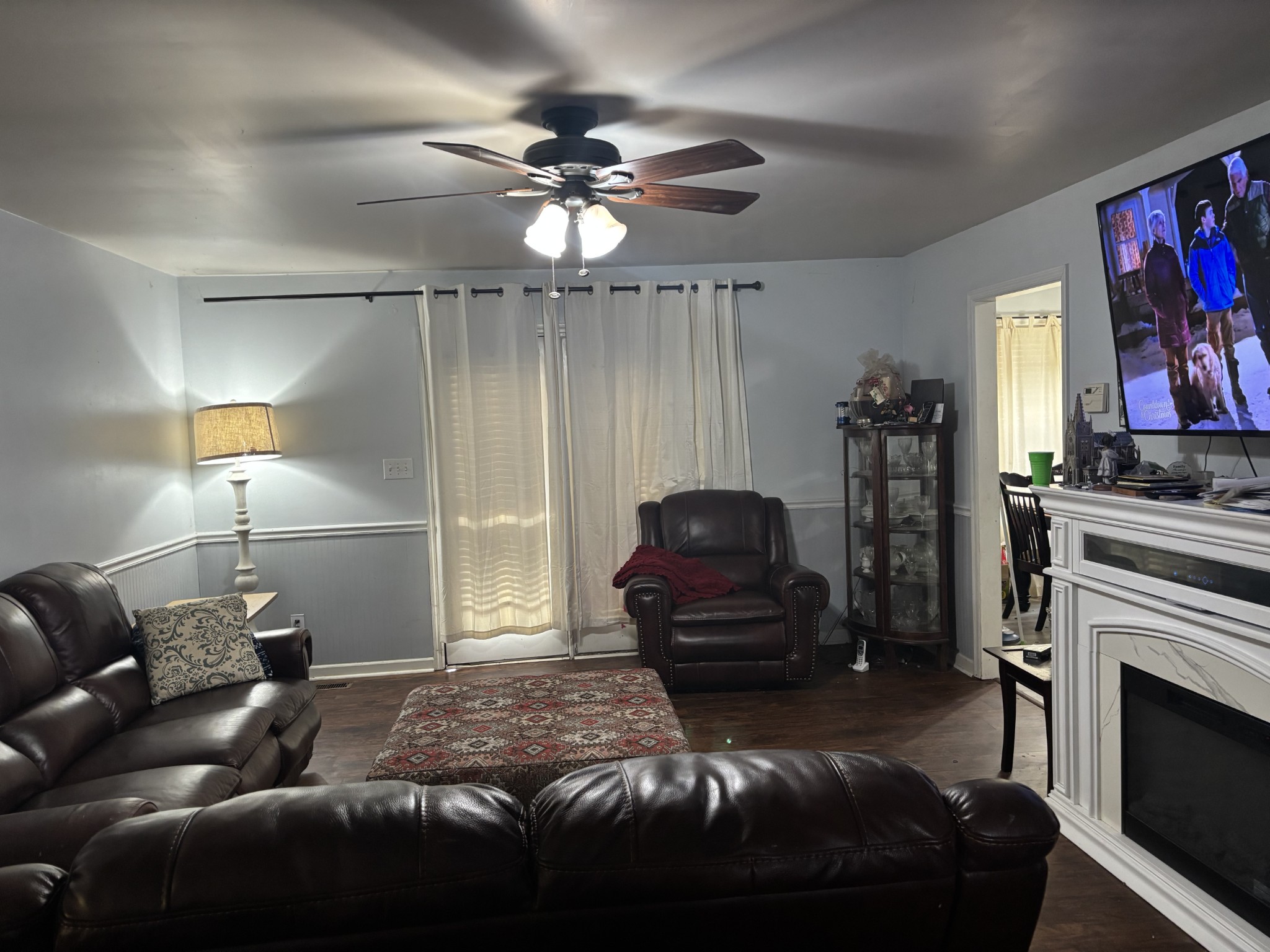 2892 Dodson Gap Road Culleoka, TN 38451 - Photo 3 of 13 a living room with furniture a fireplace and a flat screen tv