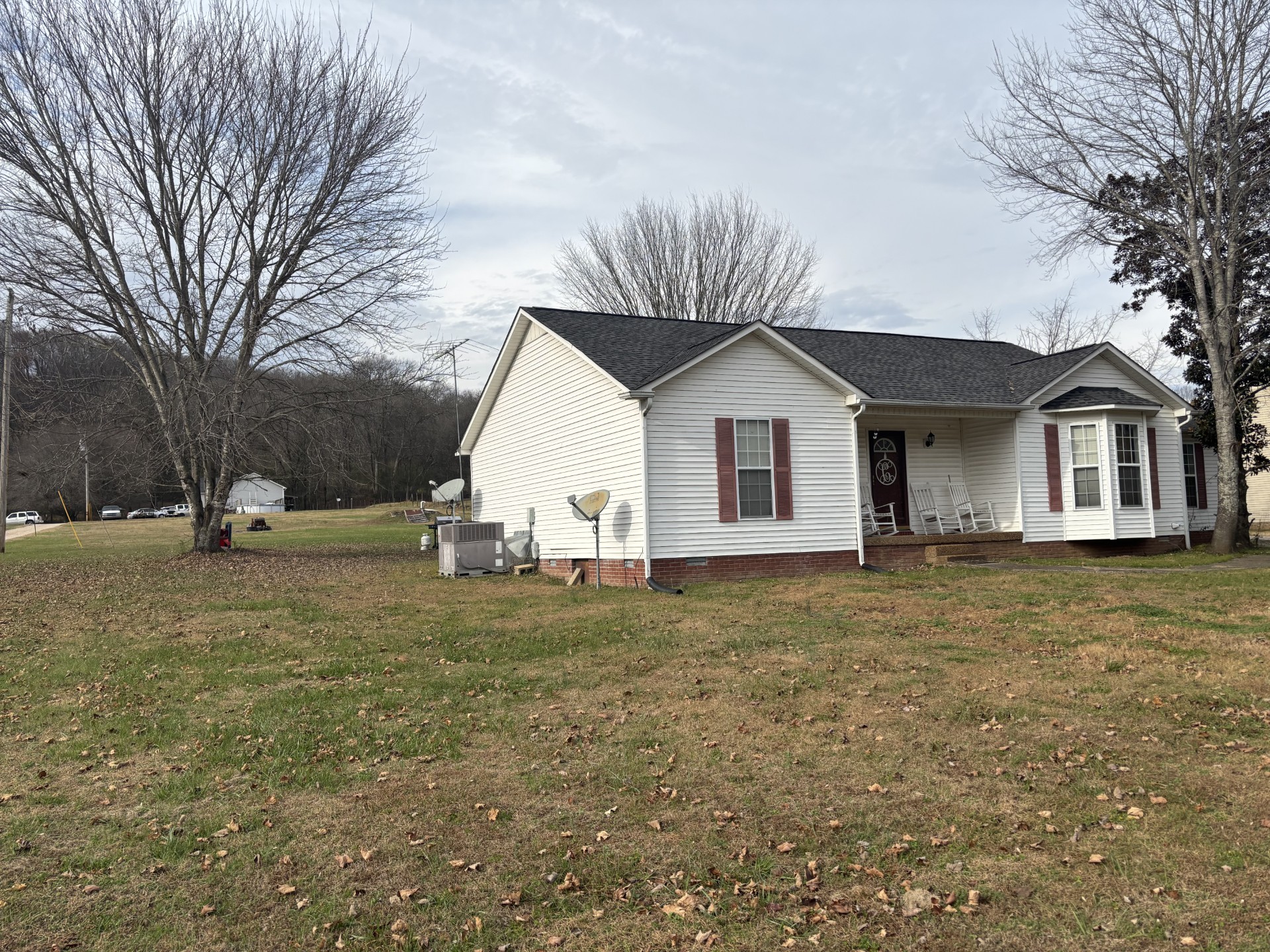 2892 Dodson Gap Road Culleoka, TN 38451 - Photo 10 of 13 a view of a yard in front of a house with large trees