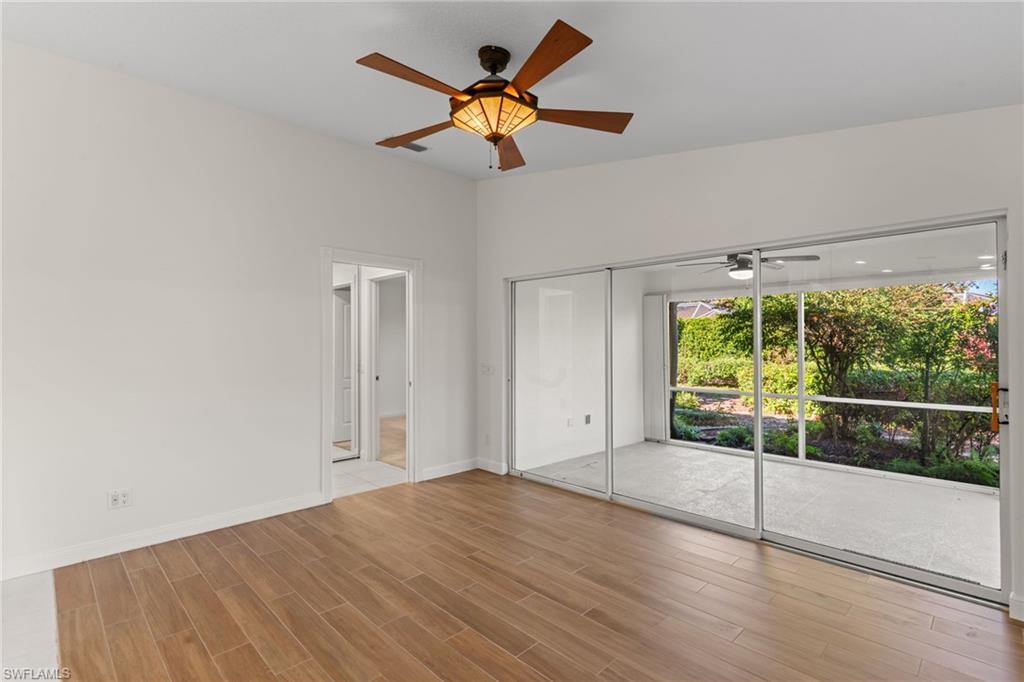 4907 Kingston Way Naples, FL 34119 - Photo 20 of 49 a view of an empty room with a window
