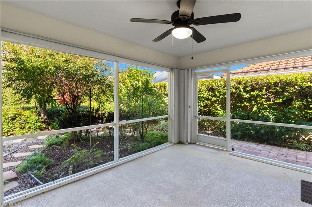 4907 Kingston Way Naples, FL 34119 - Photo 23 of 49 a view of a room with a large window and wooden floor