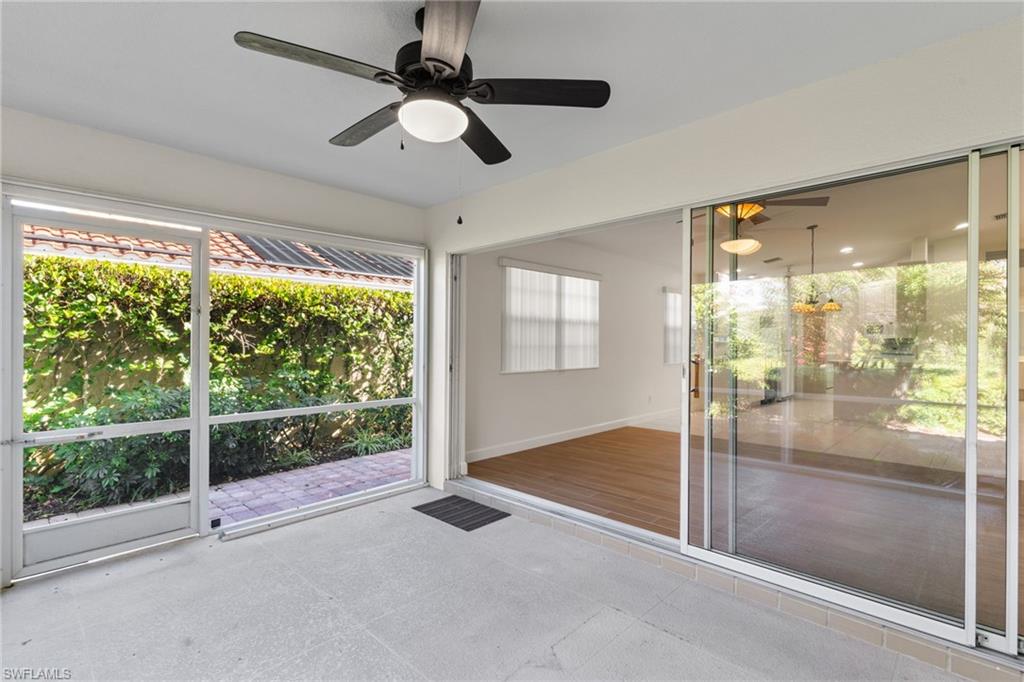 4907 Kingston Way Naples, FL 34119 - Photo 24 of 49 a view of empty room with wooden floor and fan